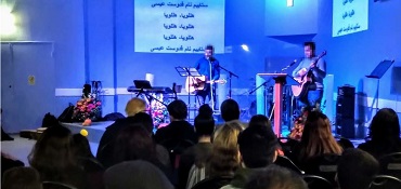 Music team leading worship at the Afghan Church